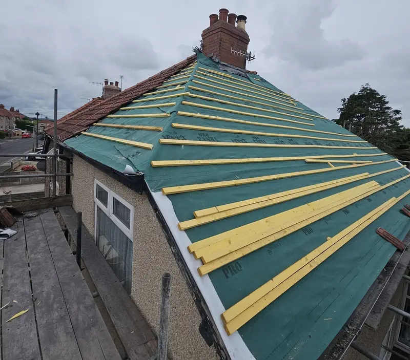 Green breathable membrane and new timber battens fixed over the hipped roof